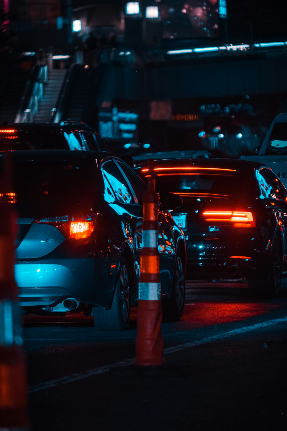 red and white car on road during night time