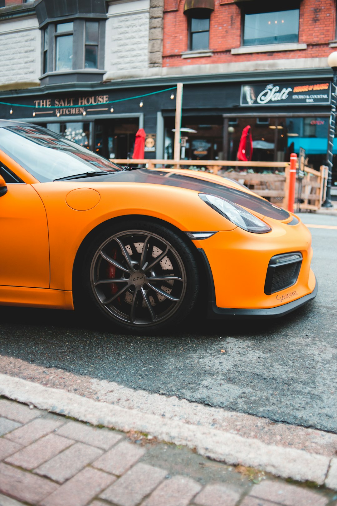 yellow ferrari 458 italia parked on street during daytime