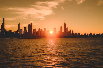 A warm golden-hued photo of the San Francisco skyline at sunset, reflecting the creative spirit of Contemplate Today.