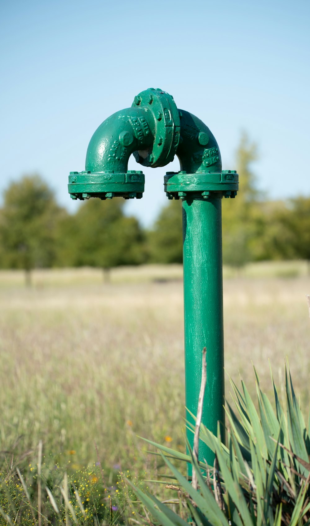 green metal pipe with handle