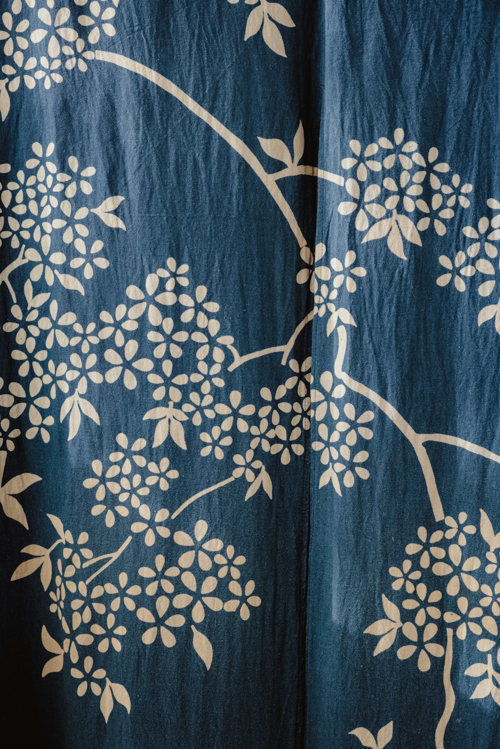 blue and white floral textile