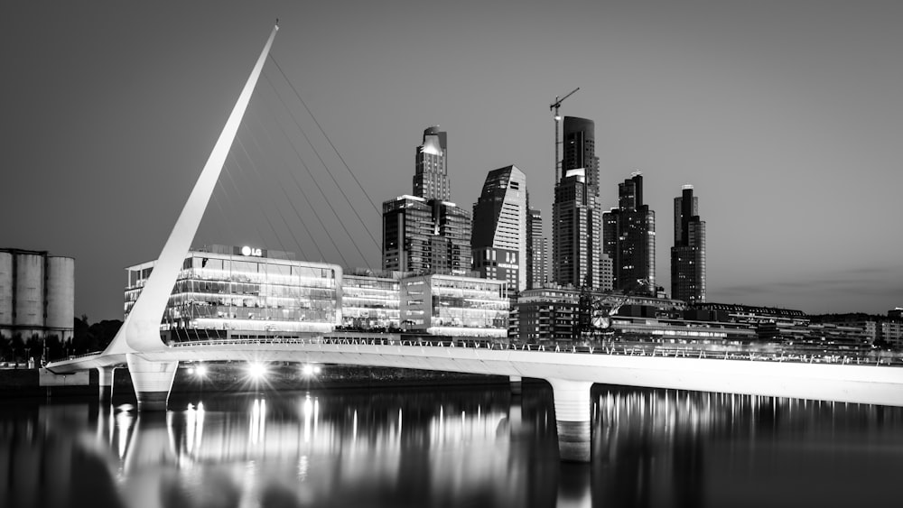 grayscale photo of city skyline during night time