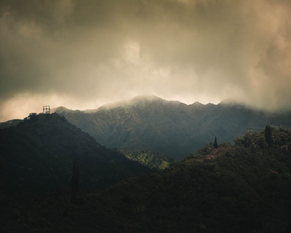 green mountains under white clouds during daytime