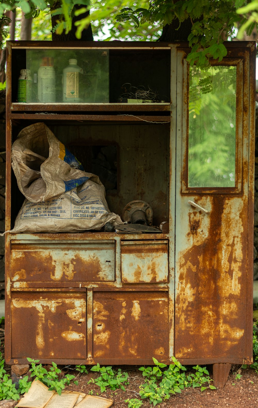 brown wooden cabinet with clothes