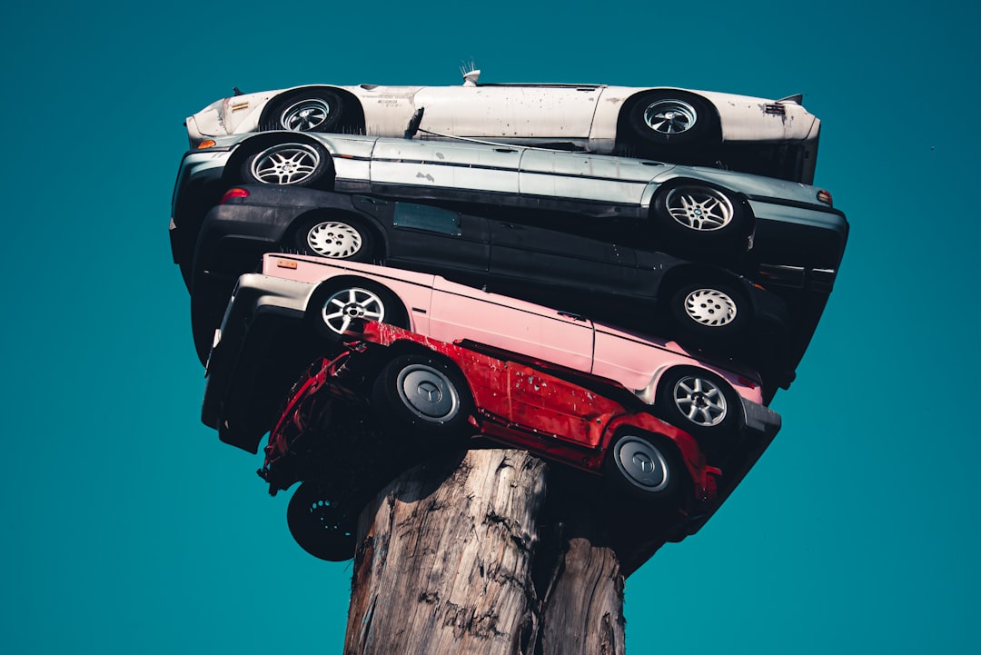 red and white car on brown wooden post