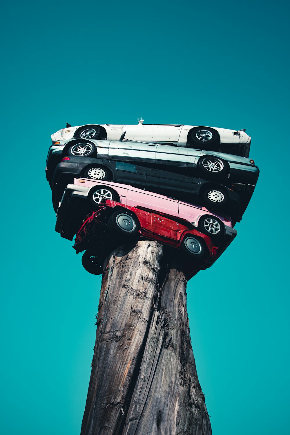 black and red car on brown wooden post