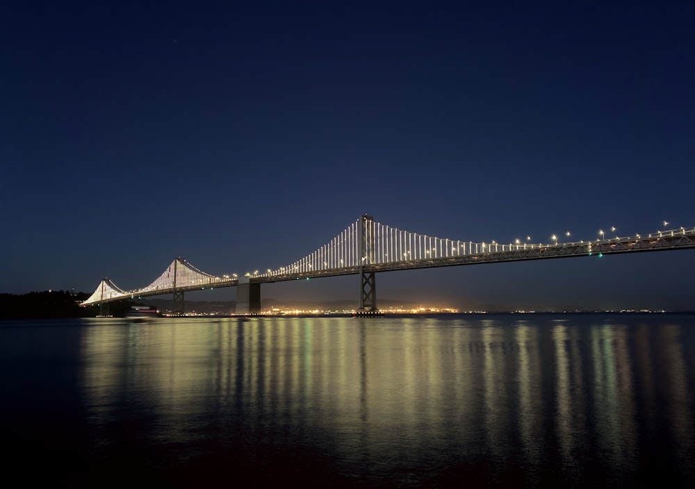 bridge over water during night time