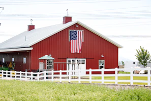 red and white wooden barn house