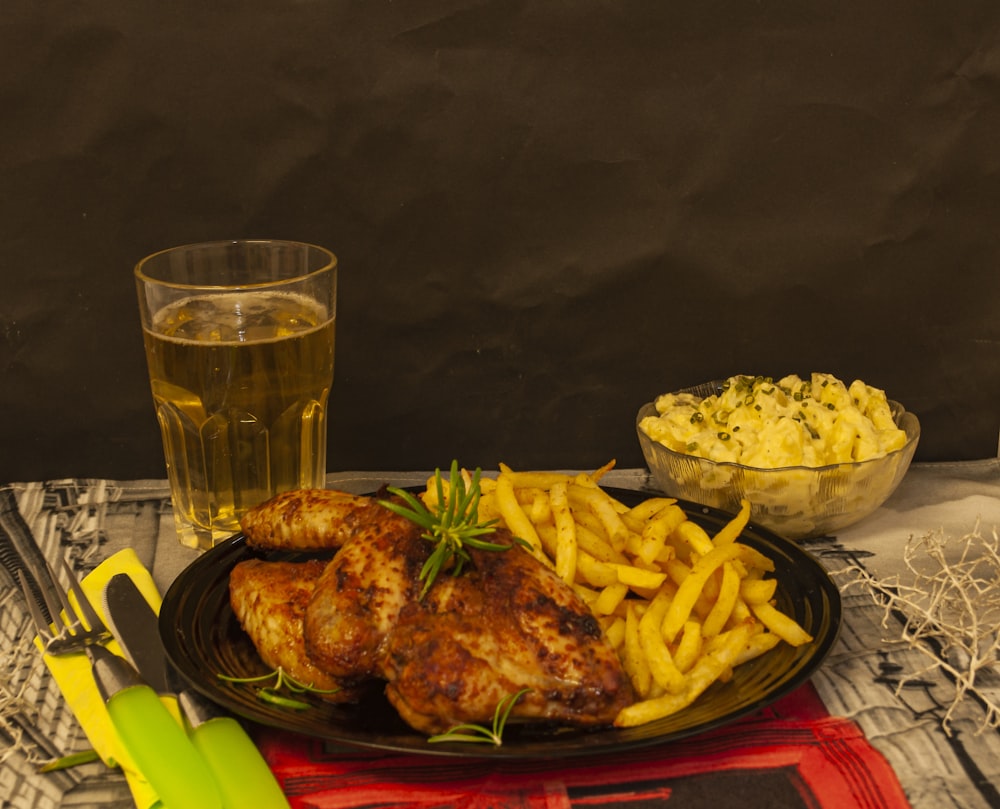 fried chicken on red and white ceramic plate