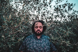 A peaceful traveler immersed in nature during a transformative journey.