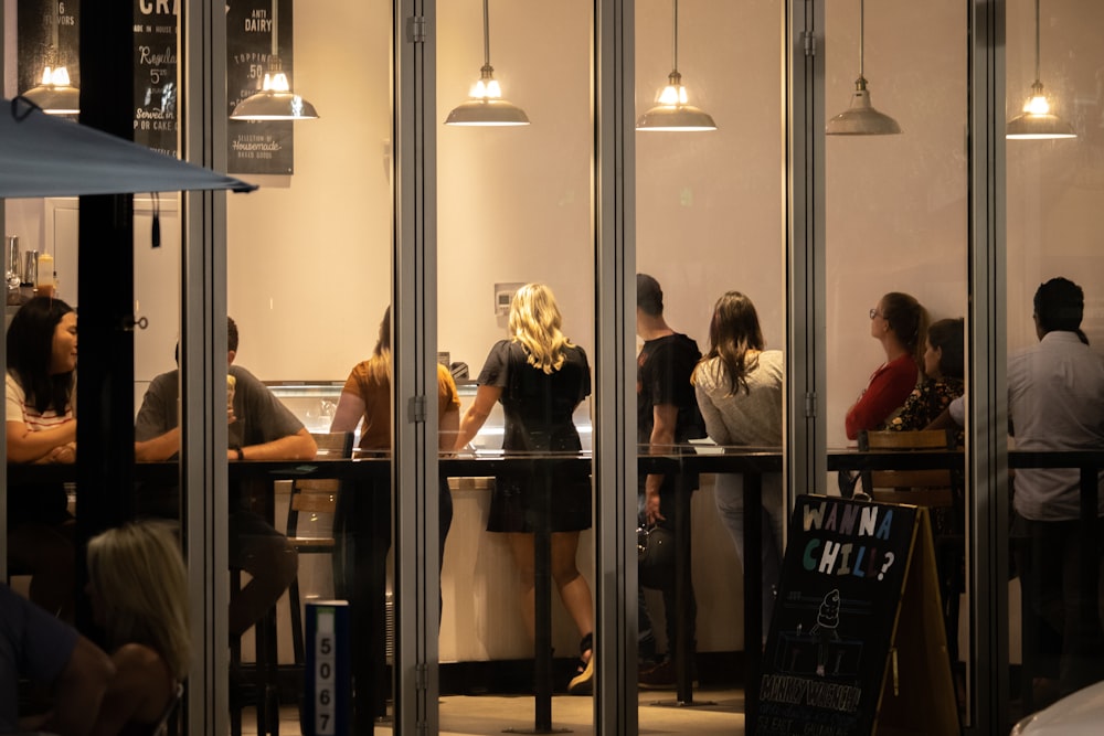 people sitting on chair inside restaurant