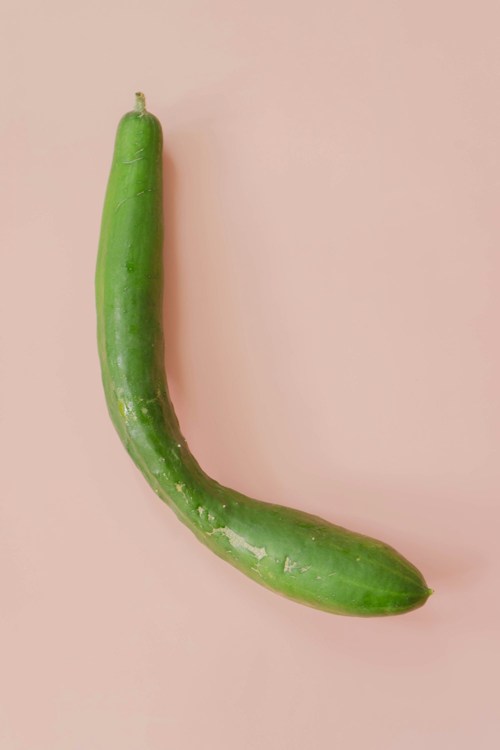 green chili on white surface
