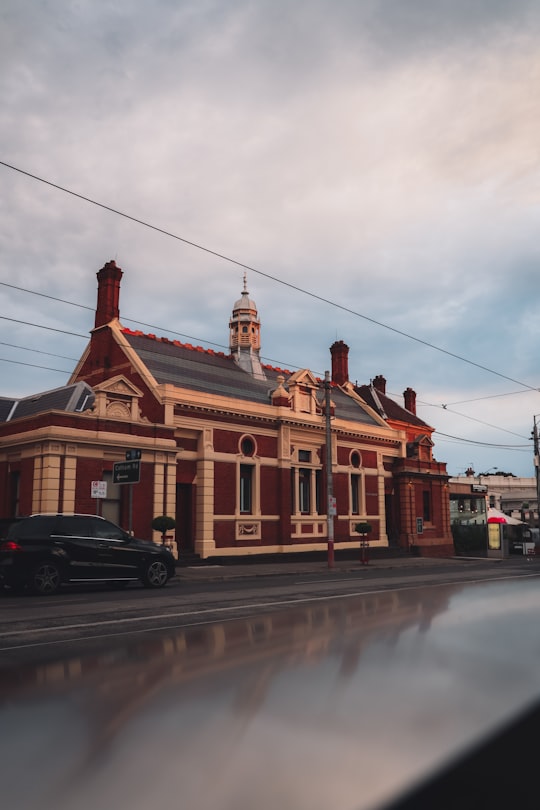 cars parked in front of brown and white building during daytime in Kew VIC Australia