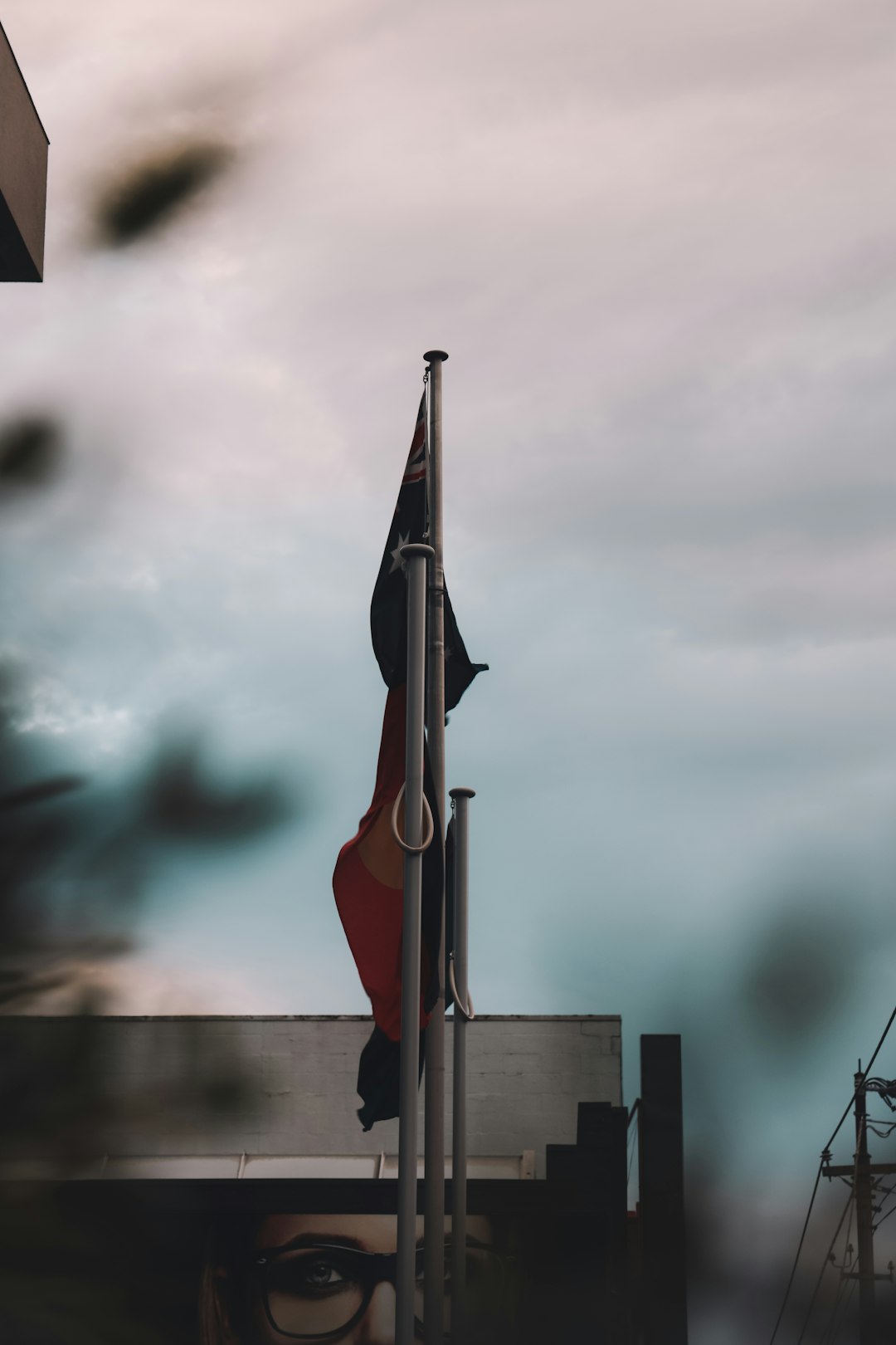 red and black flag on pole