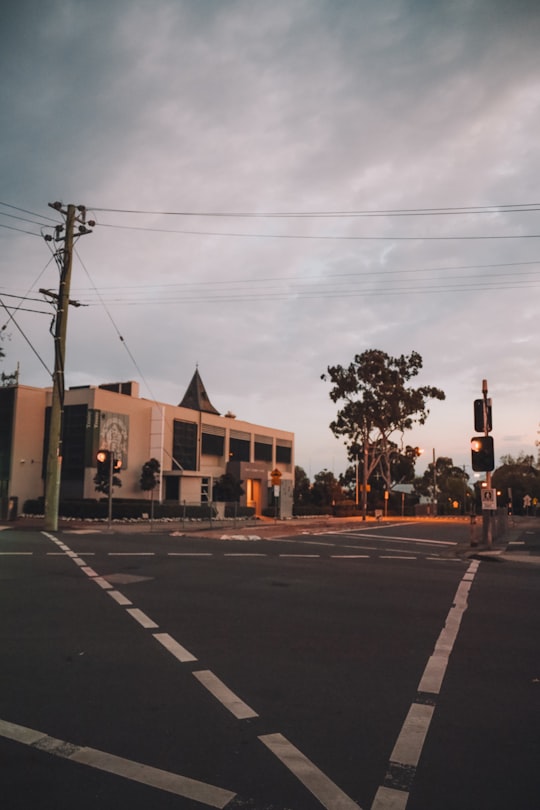 brown concrete building near green trees during daytime in Kew VIC Australia