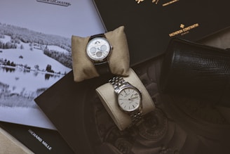 silver round chronograph watch with silver link bracelet