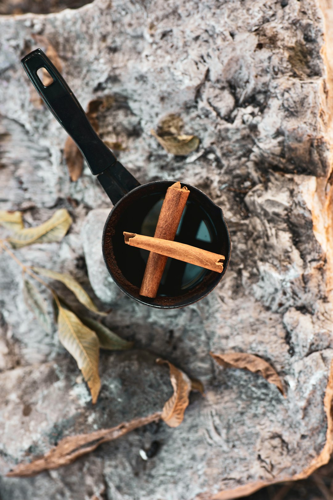 black leather belt on brown and black marble table