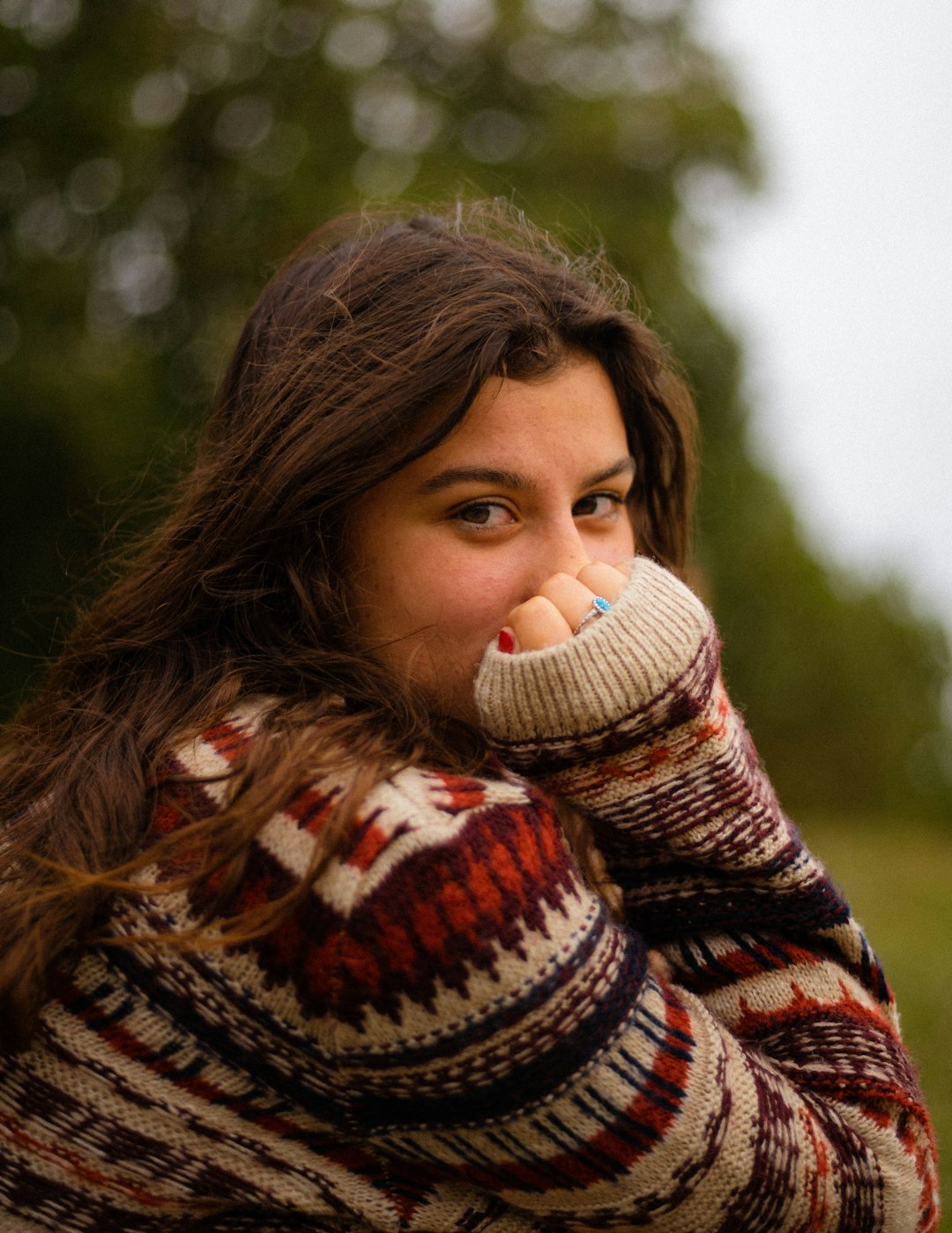 woman in brown and white knit sweater