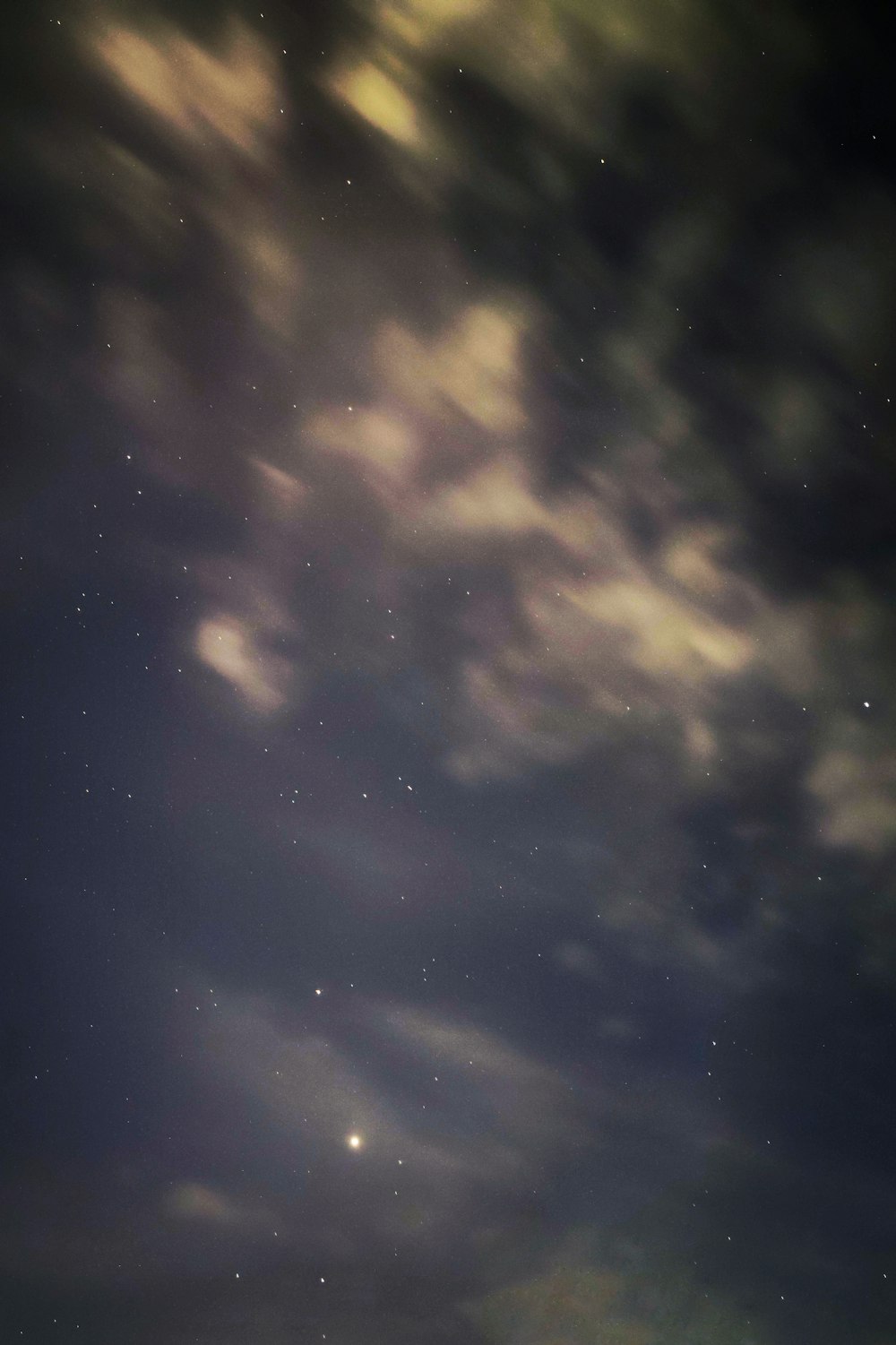 white clouds and blue sky during night time