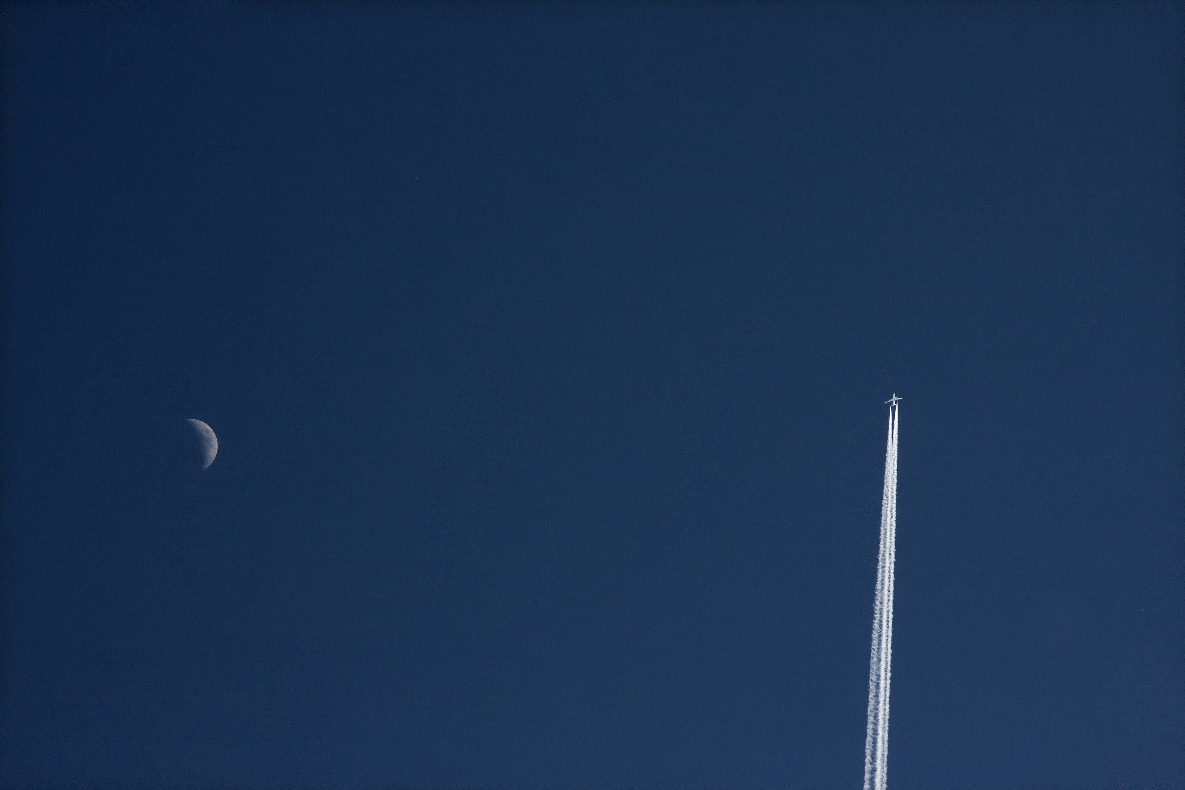white moon in blue sky