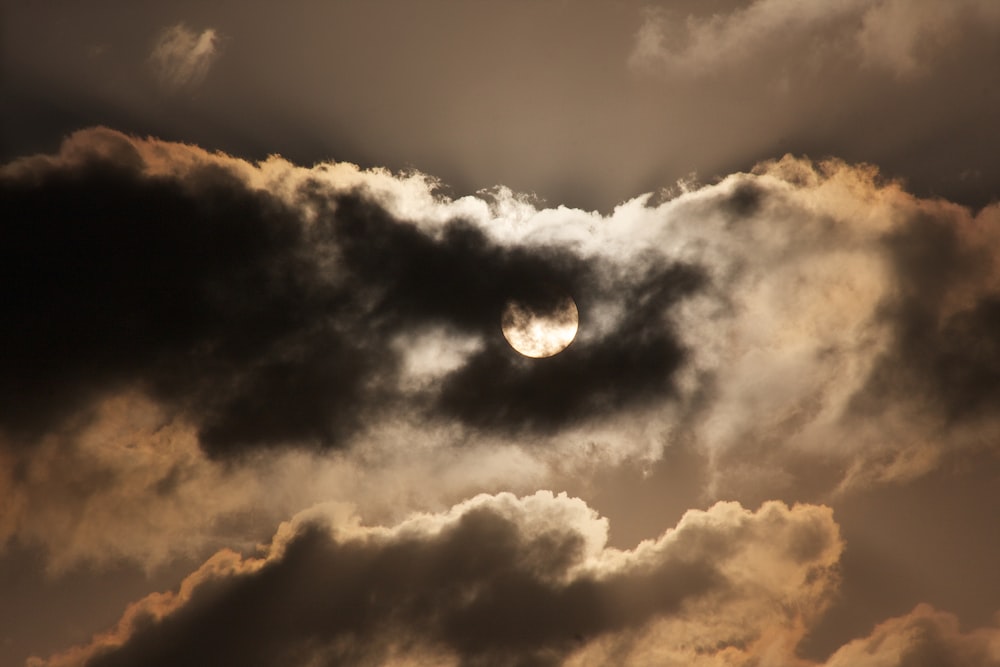 full moon covered by clouds