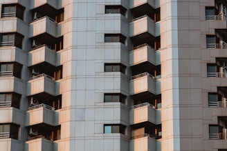 High-rise apartment complex with blue and yellow facade in Dwarka.