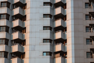 High-rise apartment complex with blue and yellow facade in Dwarka.