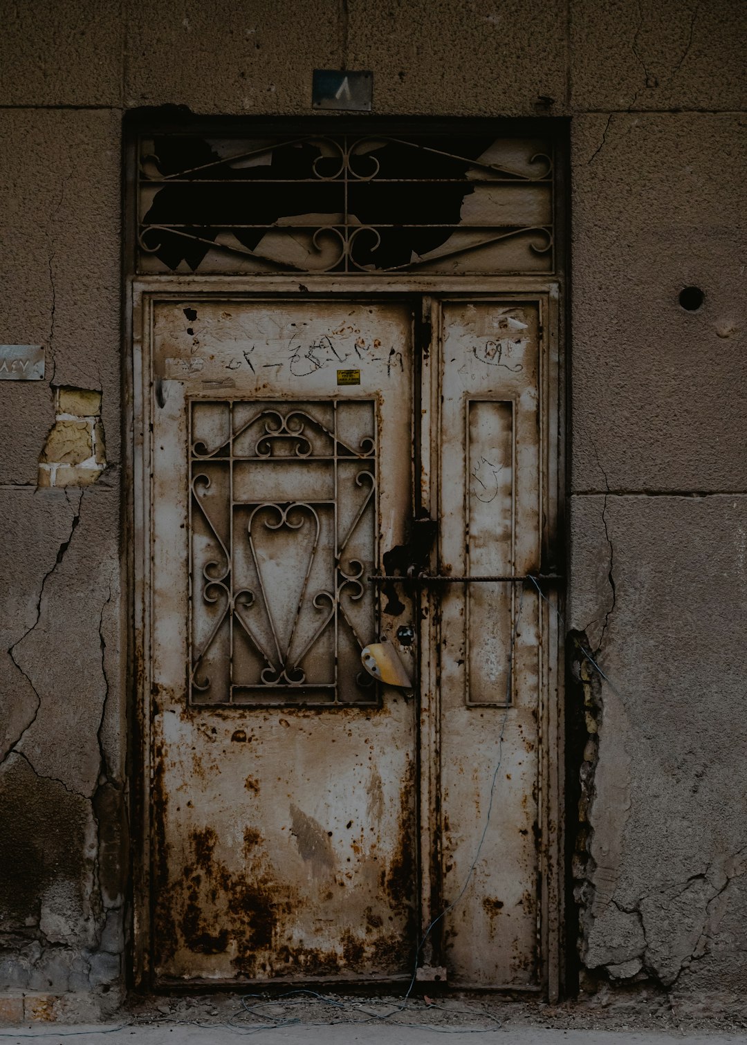 grey metal door with padlock