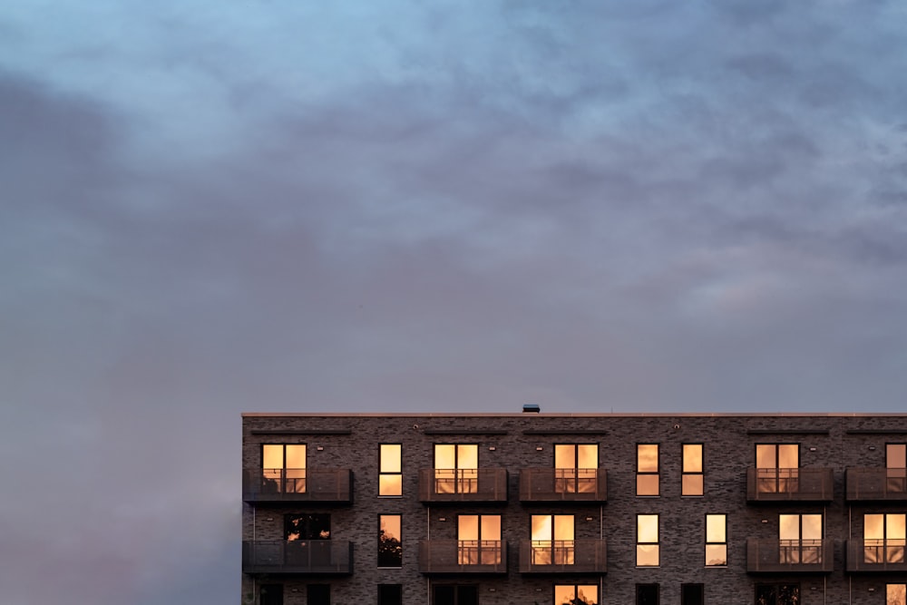 brown concrete building under gray sky
