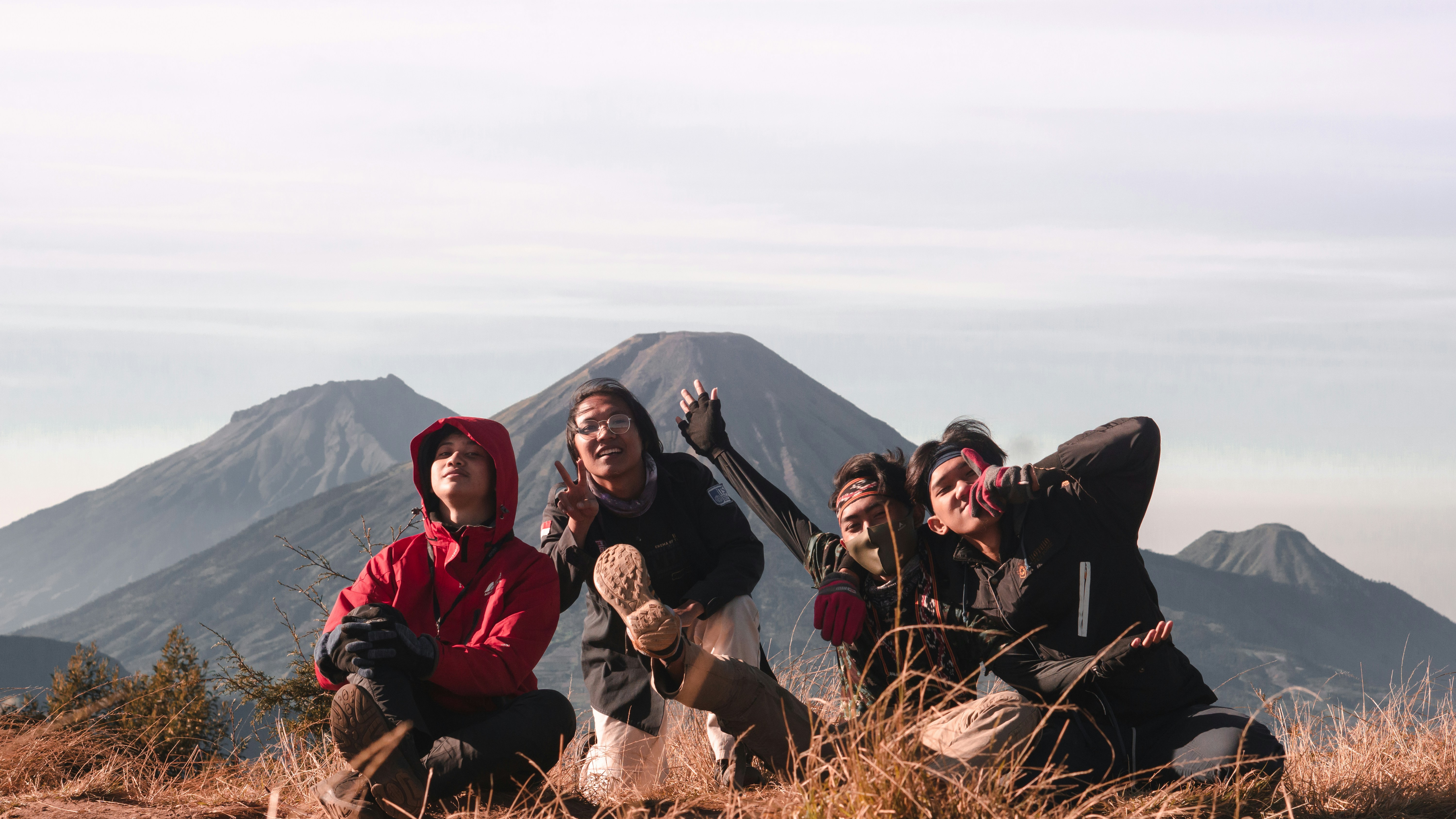 Group sitting on grass field