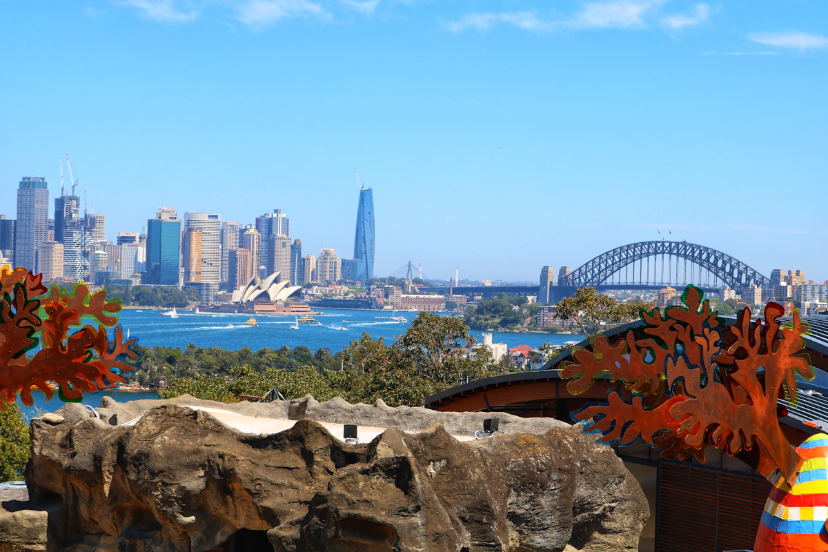 Sydney Opera House and Harbour Bridge seen from an elevated Taronga Zoo terrace