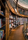 brown wooden book shelves with books