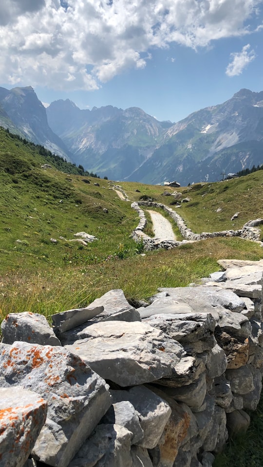 rocky mountain under blue sky during daytime in Refuge des Barmettes France