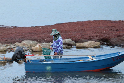 Hunters in camouflage gear ready on the boat’s pop-up blind