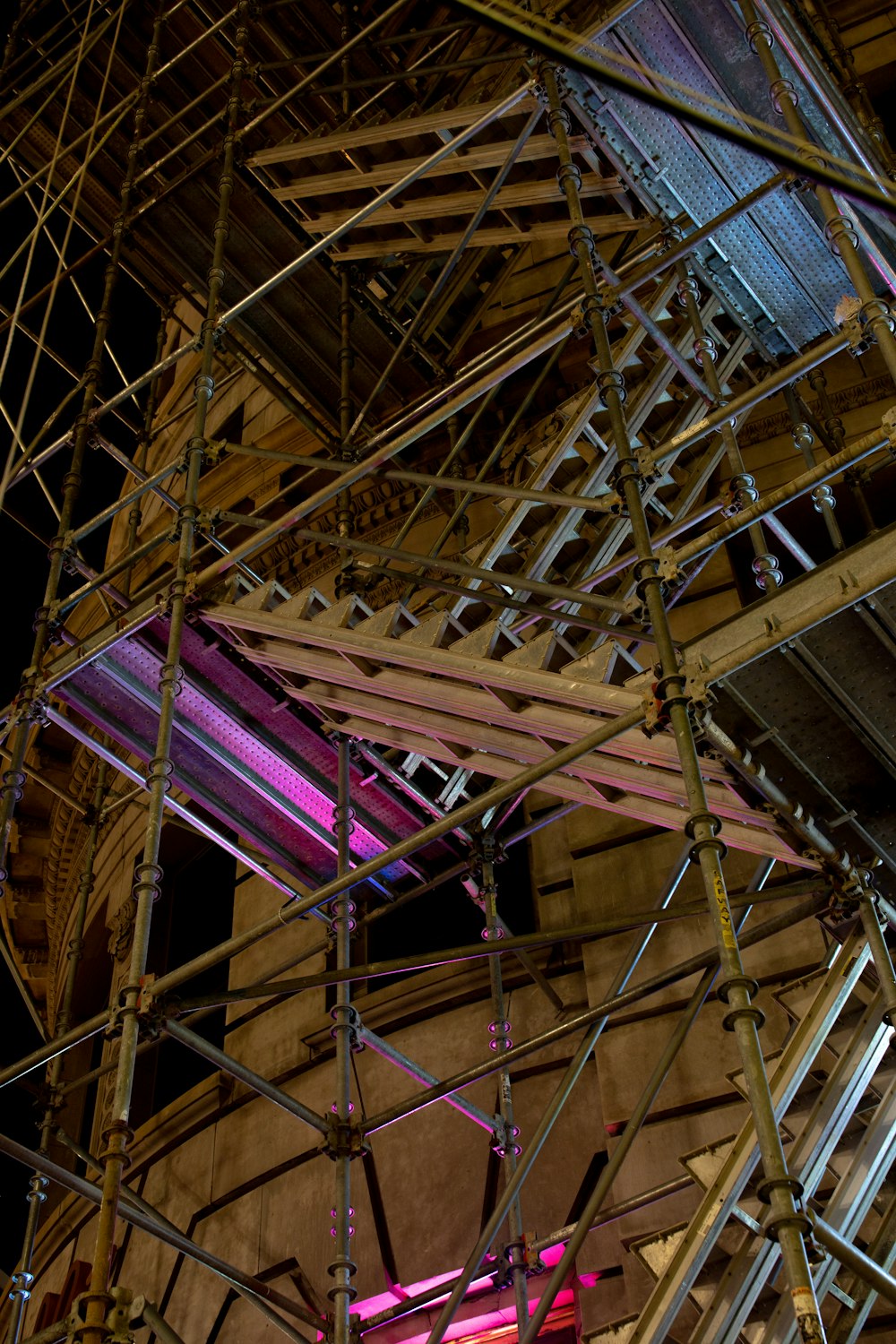 brown wooden ceiling with purple and brown metal frame