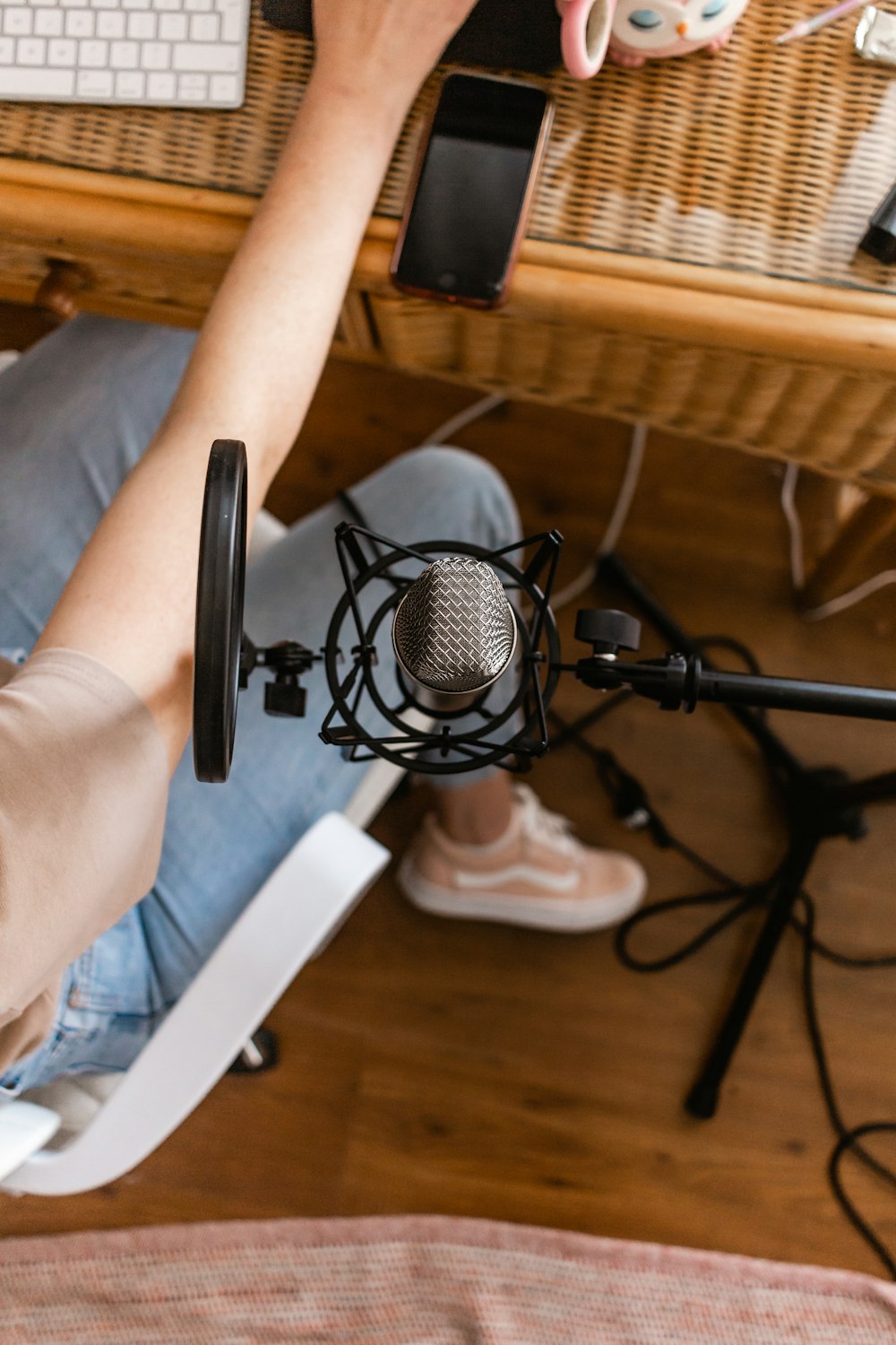 black and gray headphones on persons hand