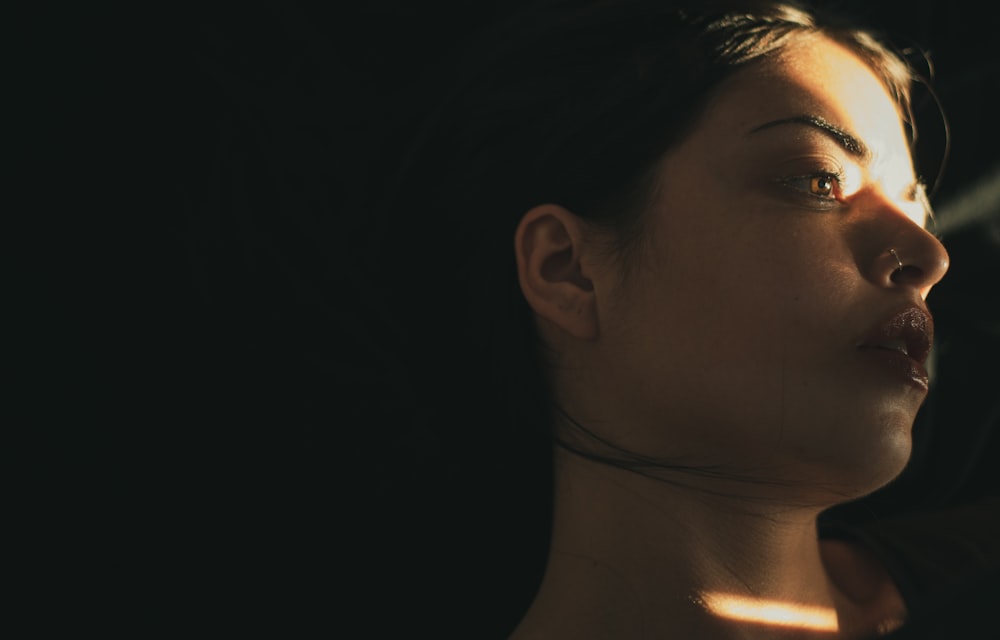 woman wearing silver stud earring