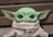 green frog plush toy on brown textile