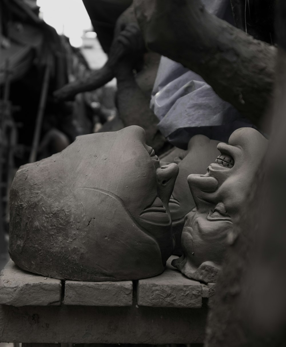 brown concrete statue of man and woman