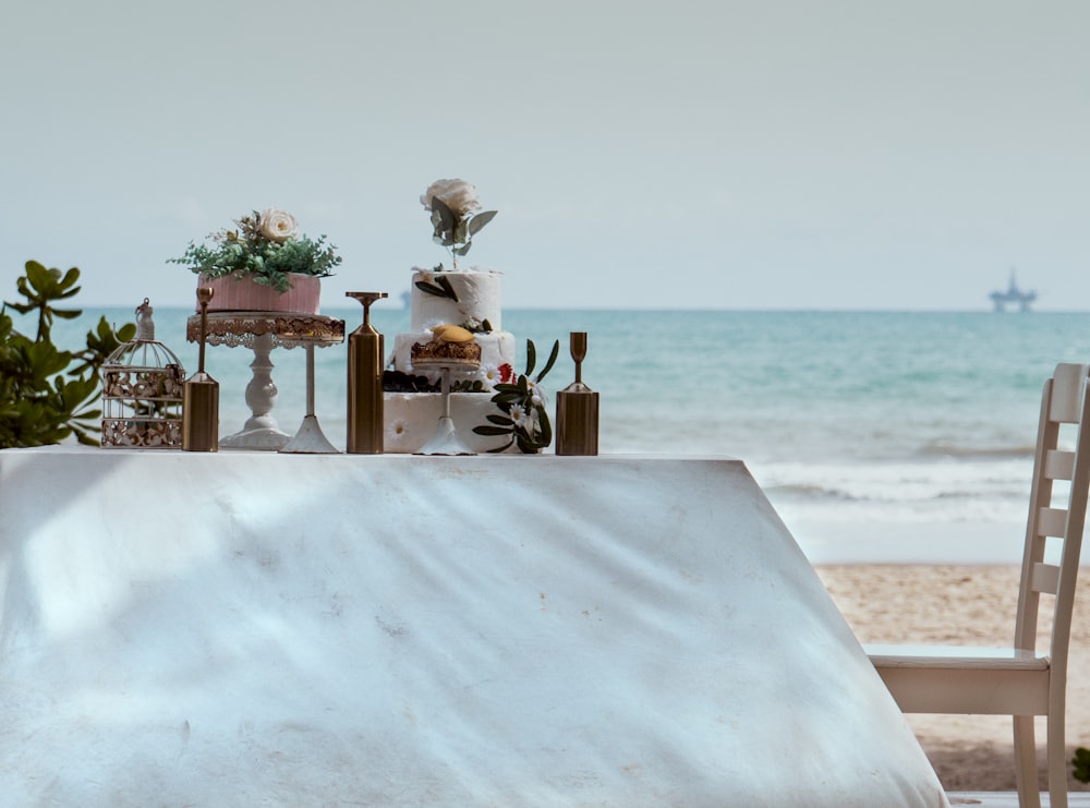 brown wooden table with chairs on white sand beach during daytime