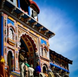 people walking near brown concrete building during daytime