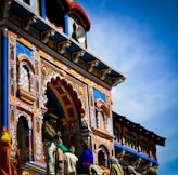 people walking near brown concrete building during daytime