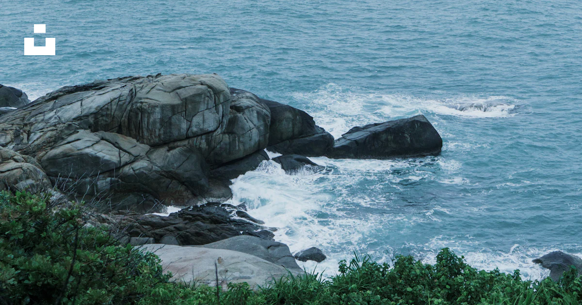 Gray rock formation on sea during daytime photo – Free Sanya Image on ...