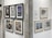 A gallery wall featuring a collection of framed artworks. On the left, six pieces are displayed in black frames, showcasing various abstract and figurative styles. On the right, three pieces in lighter frames, with themes ranging from abstraction to realistic imagery. A textured column separates the two sections, and a rectangular plaque provides information about the display.