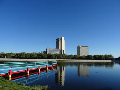 Modern urban infrastructure including bridges and buildings under a clear sky.