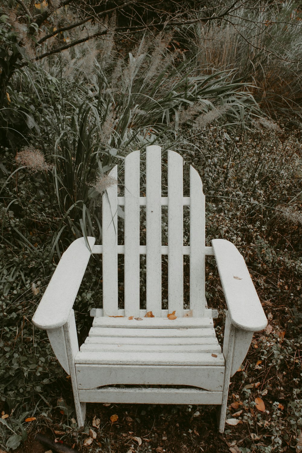 white wooden armchair on black and white photography