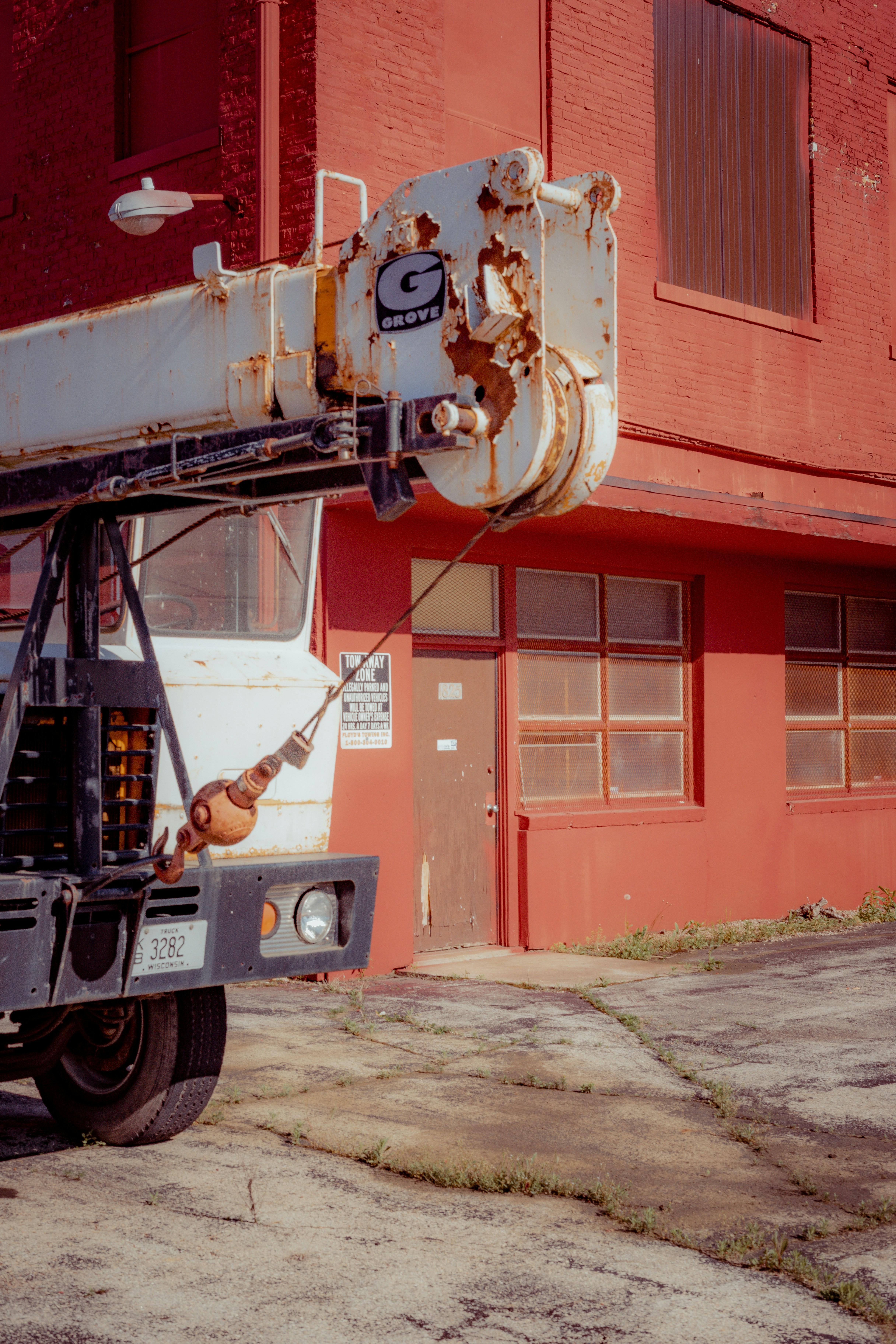 black and red truck near red building