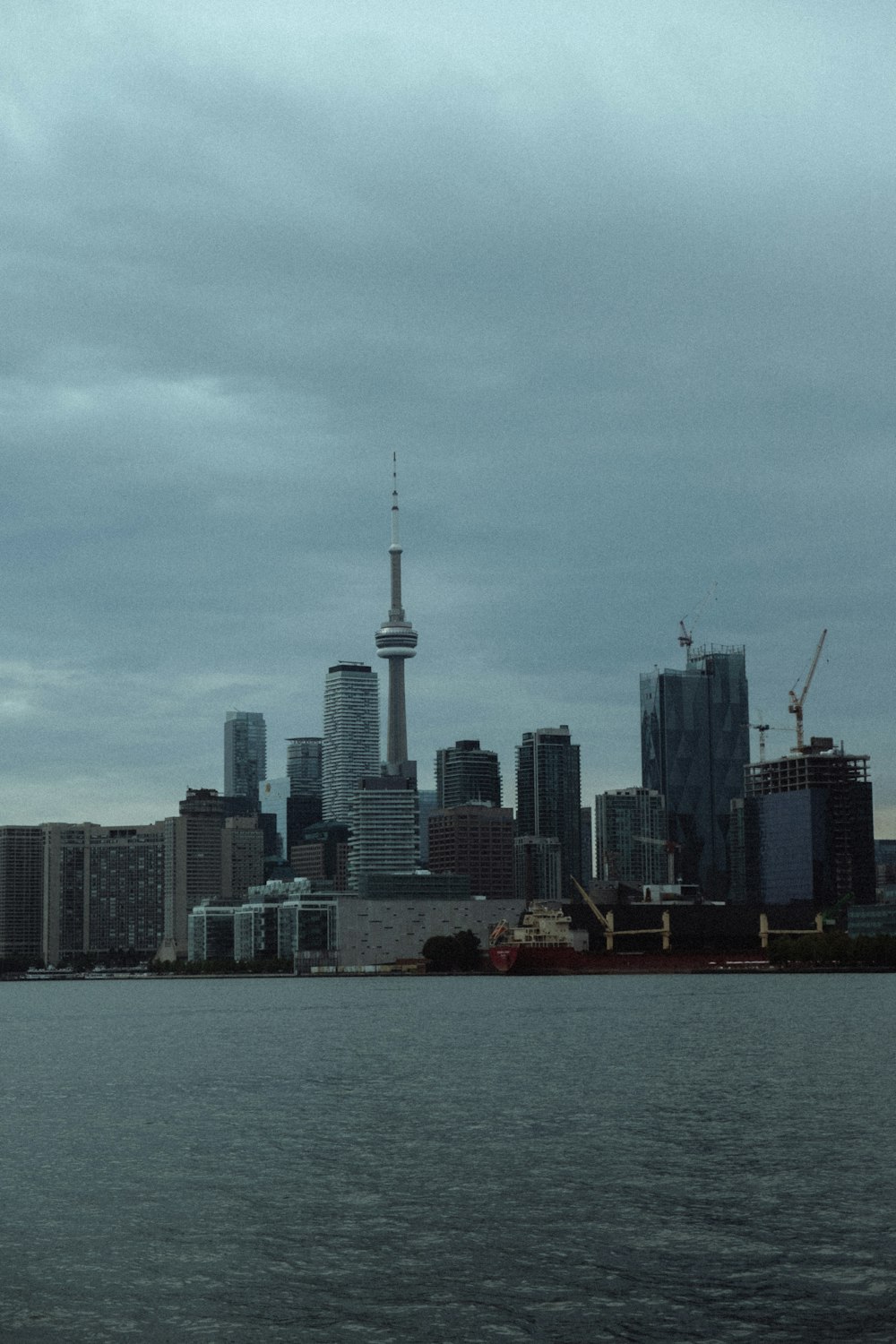 city skyline across body of water during daytime