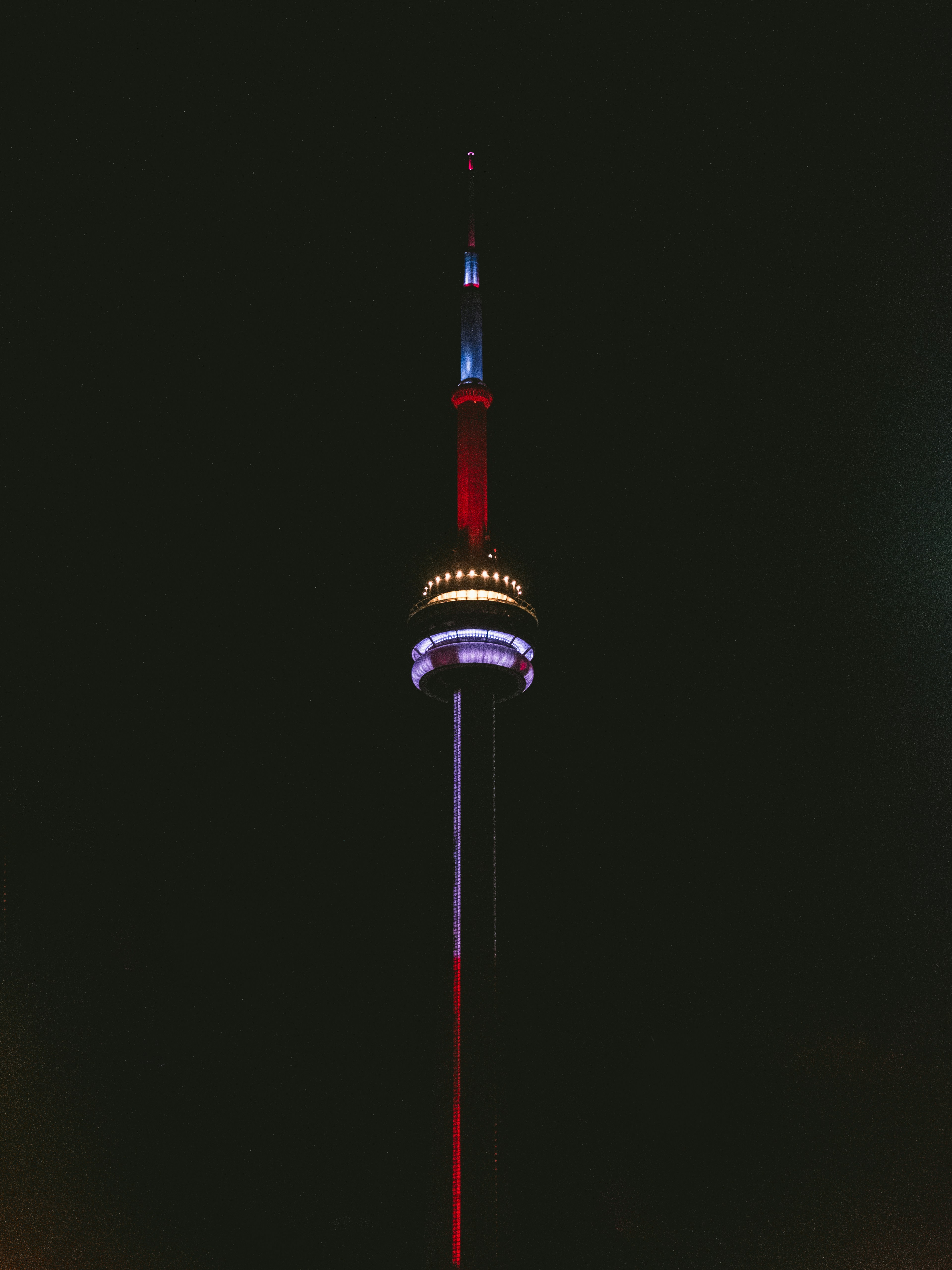 red and black tower during night time