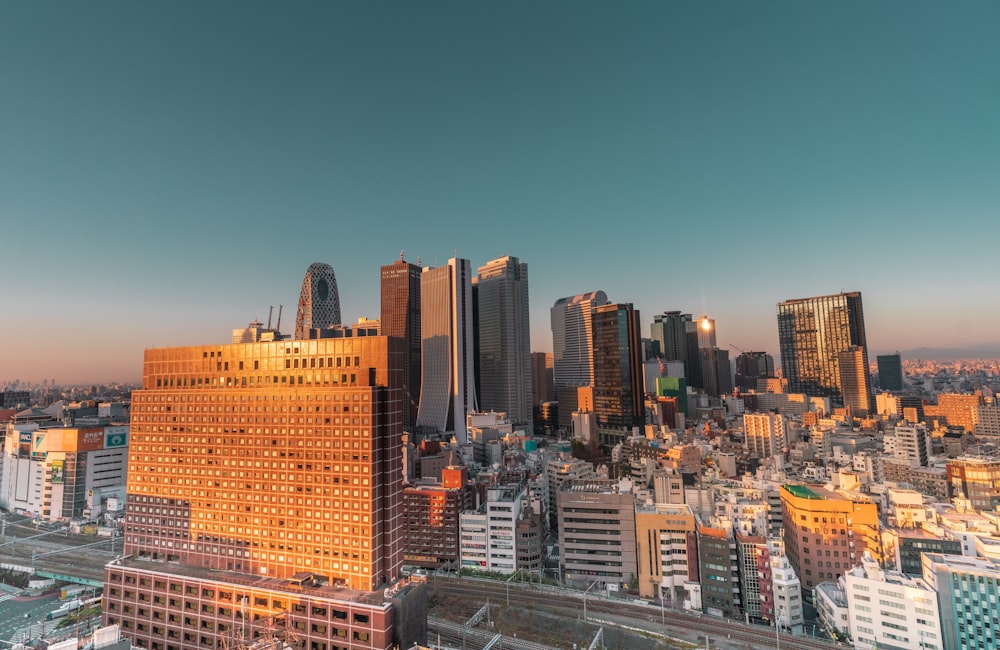 city buildings under blue sky during daytime